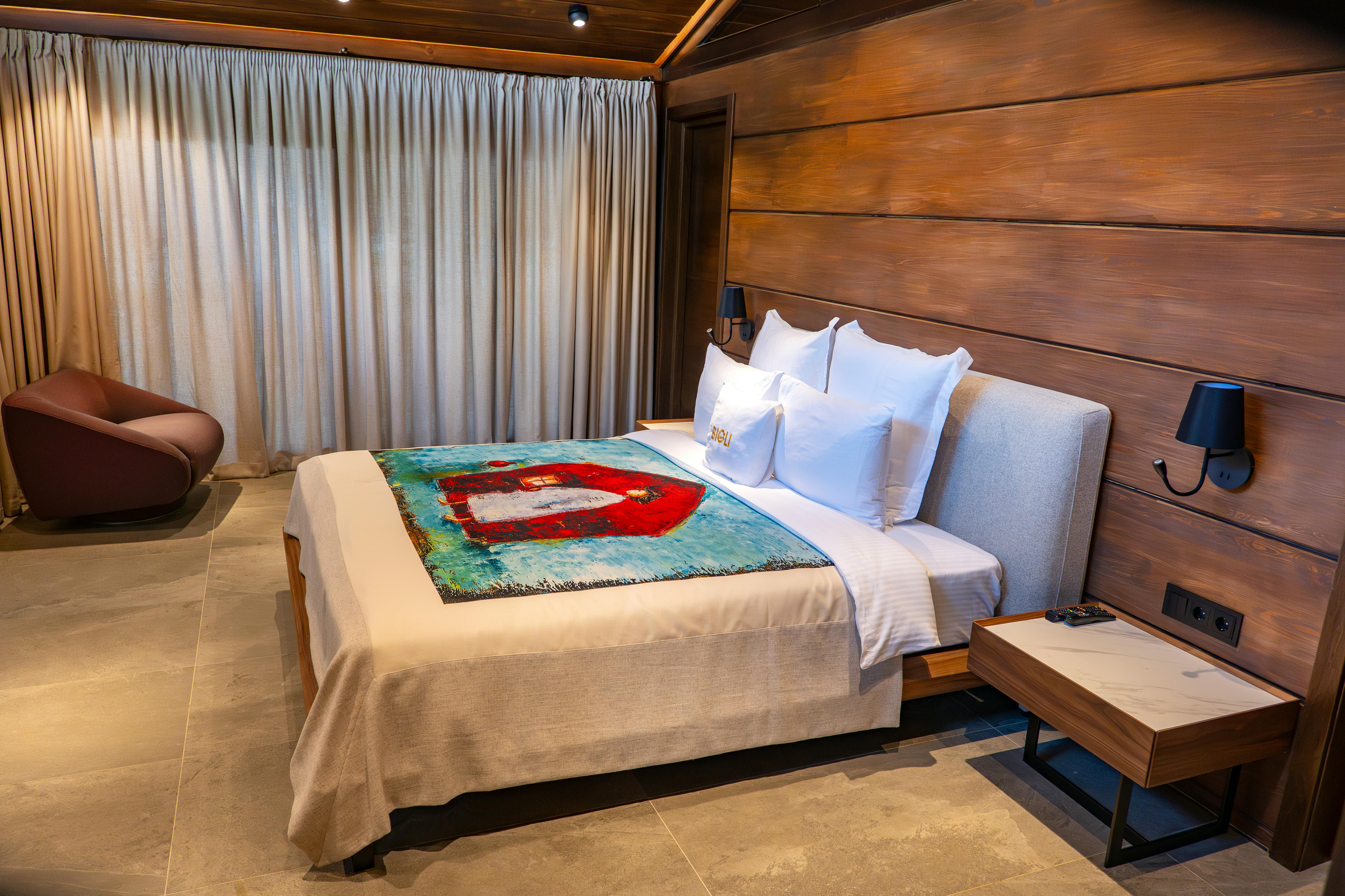 A bedroom with only one bed